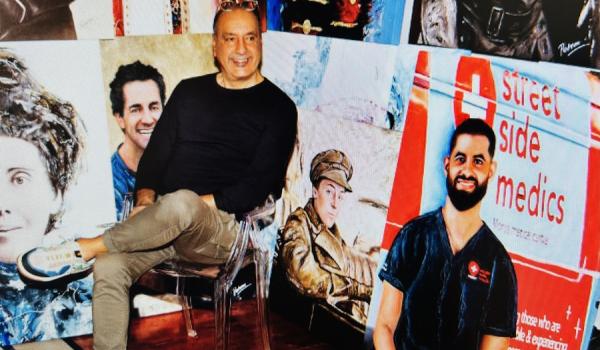 Photo of George Petrou OAM with portrait of Daniel Nour